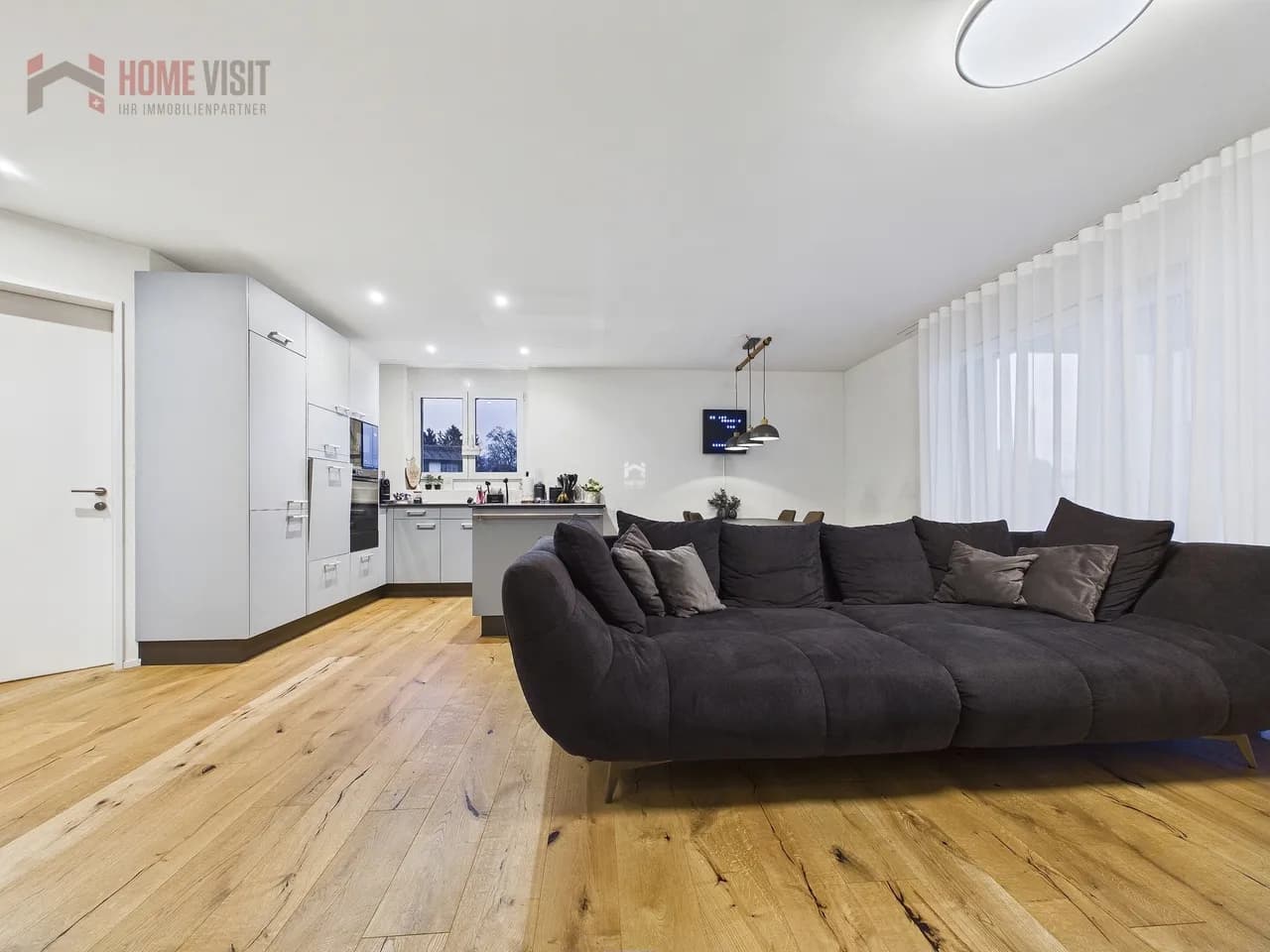 Exklusive 3.5-Zimmer-Gartenwohnung mit beheiztem Hobbyraum